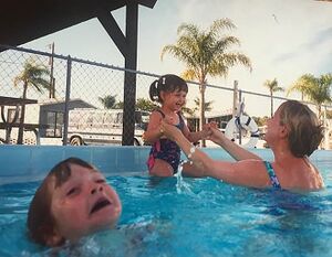 Mother Ignoring Kid Drowning In A Pool: blank meme template (one-panel)